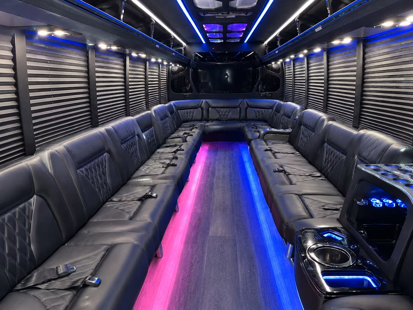 Friends laughing during a party bus celebration in Worcester